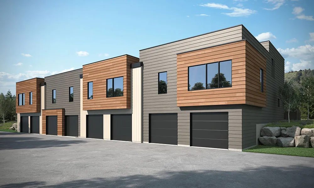 A rendering of an apartment building with garages.
